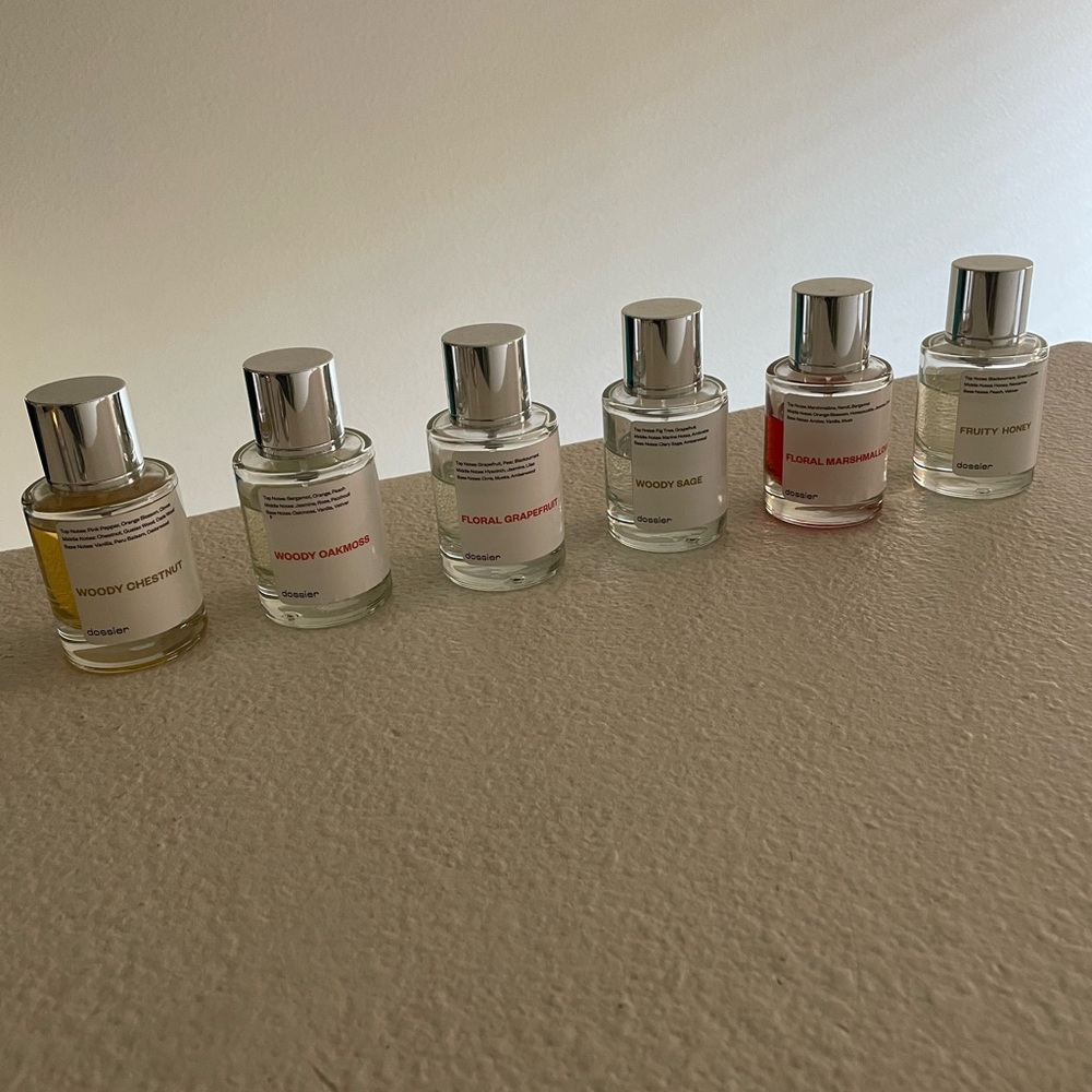Dossier perfume lot of 6 bottles at various stages of use. See photos for usage